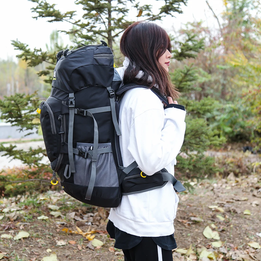 Woman wearing best hiking backpack for women on outdoor trail.